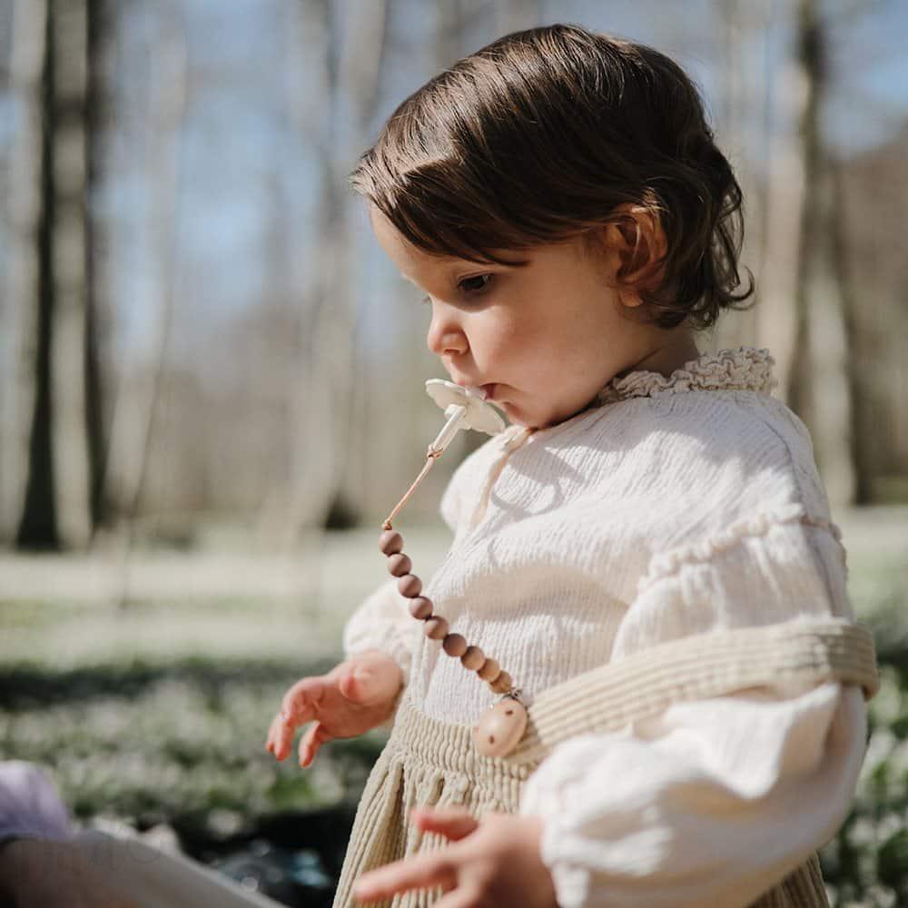 Kaučukový dudlík FRIGG DAISY CROISSANT 6-18M(1ks)