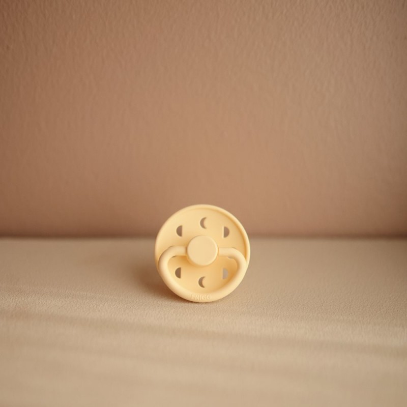 Kaučukový dudlík FRIGG MOON PHASE PALE DAFFODIL, 0-6M (1ks)