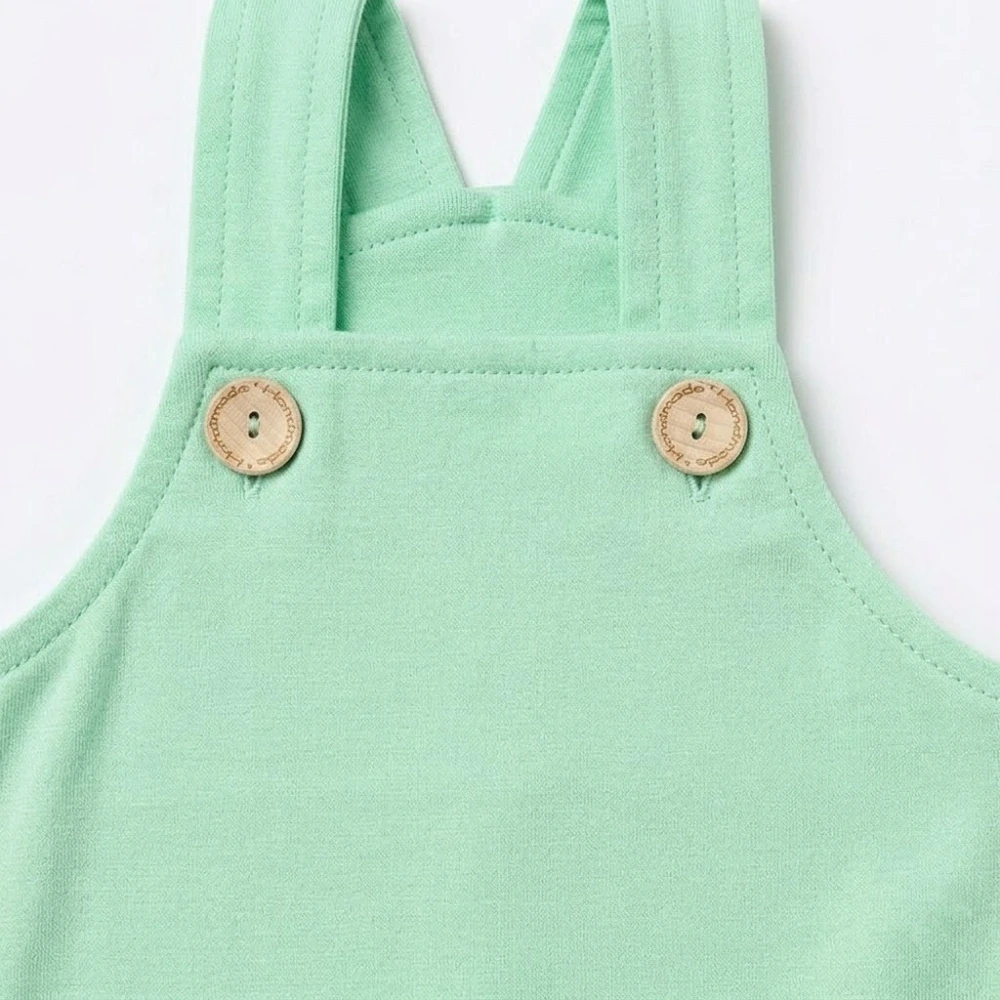 Dětské bavlněné kalhoty s laclem světle zelené vel.68