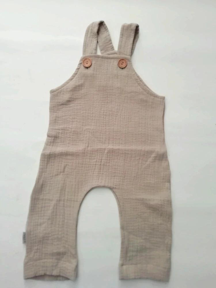 Mušelinové rolovací kalhoty s laclem béžové